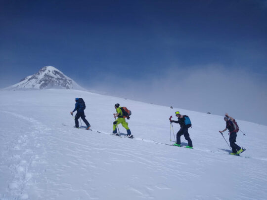 Group on skis on a snow slope in the Caucasus
